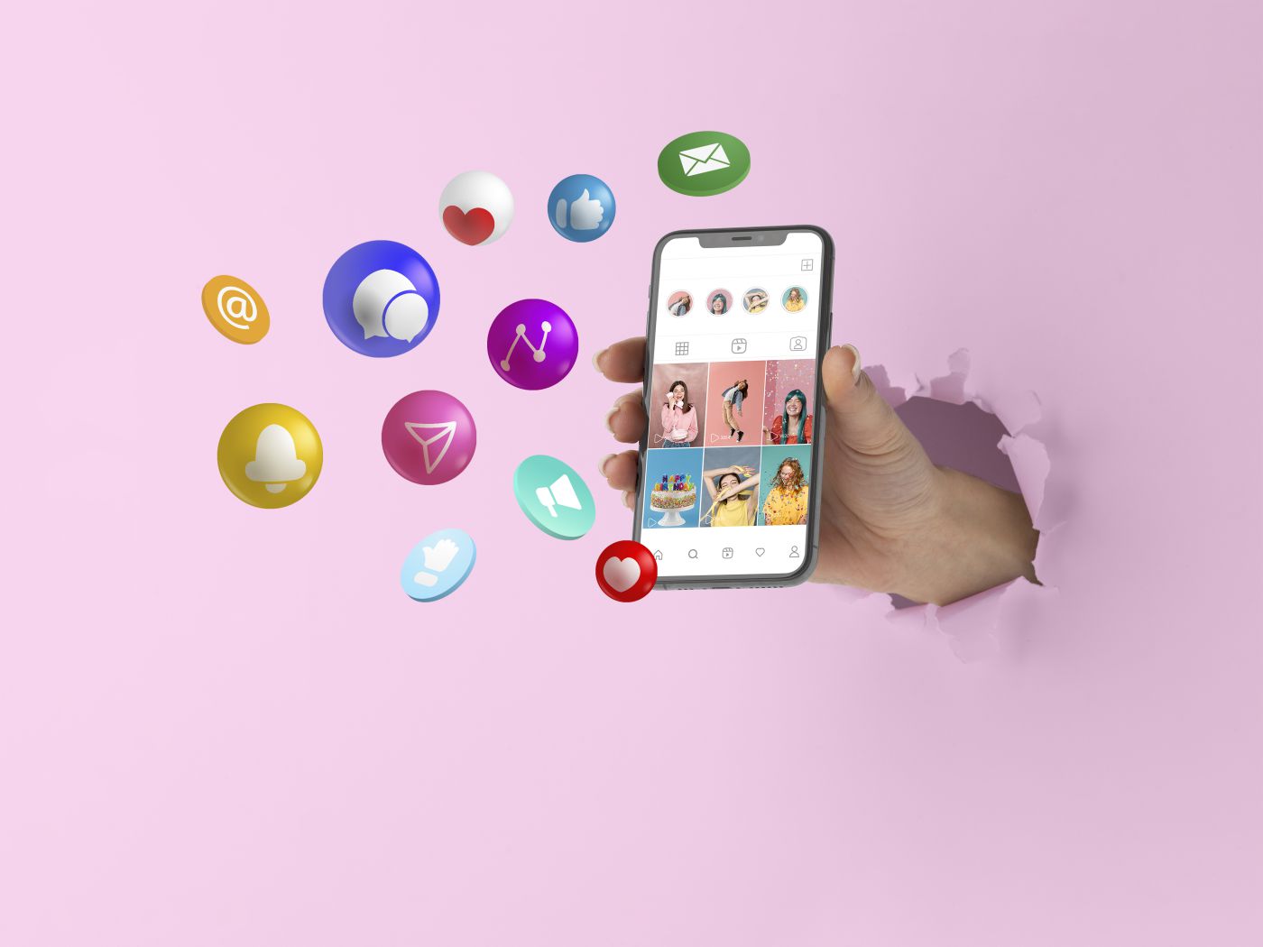 Hand holding a phone showing a social media profile grid, with notification and message icons around it
